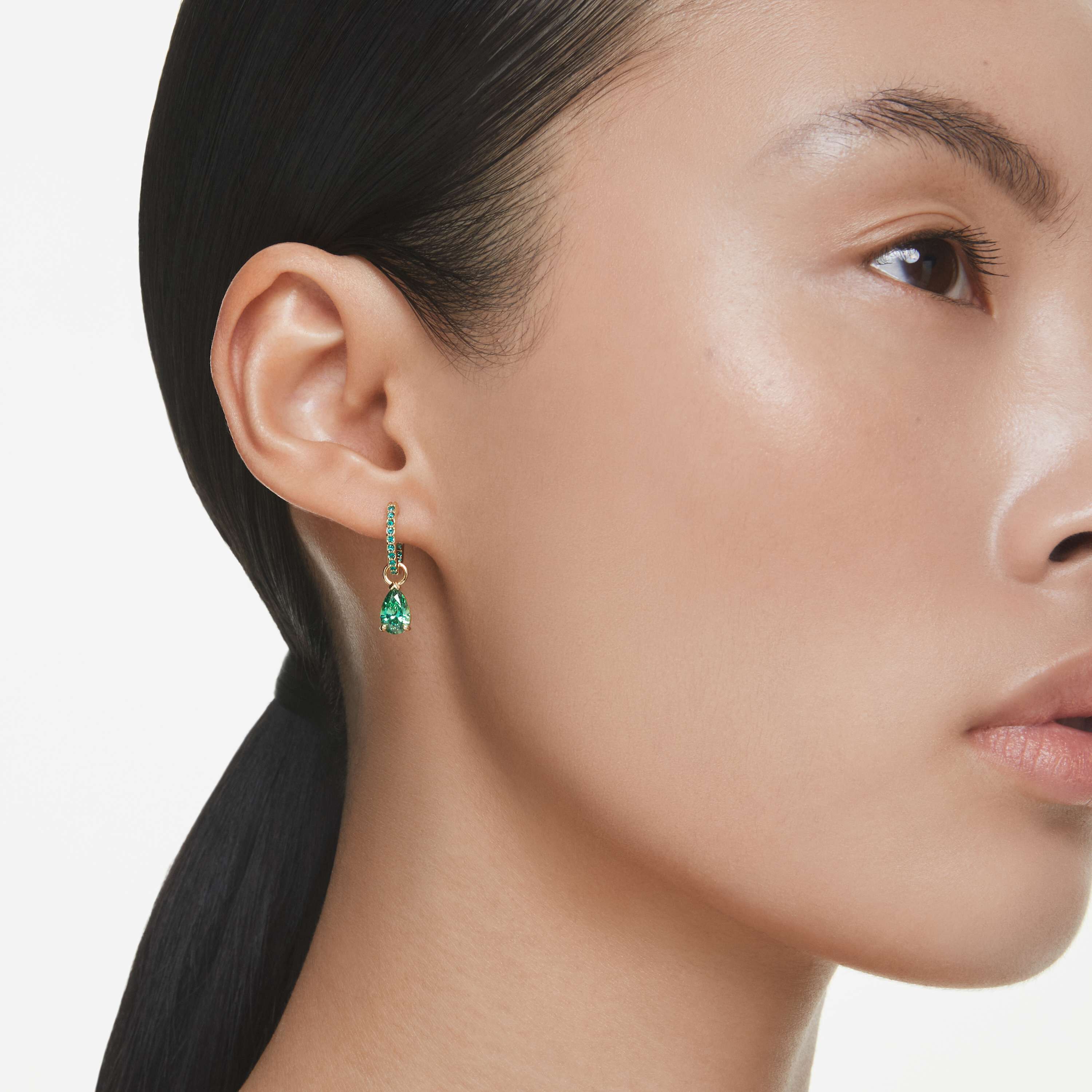 swarovski attract drop earrings  pear cut  green  gold tone plated