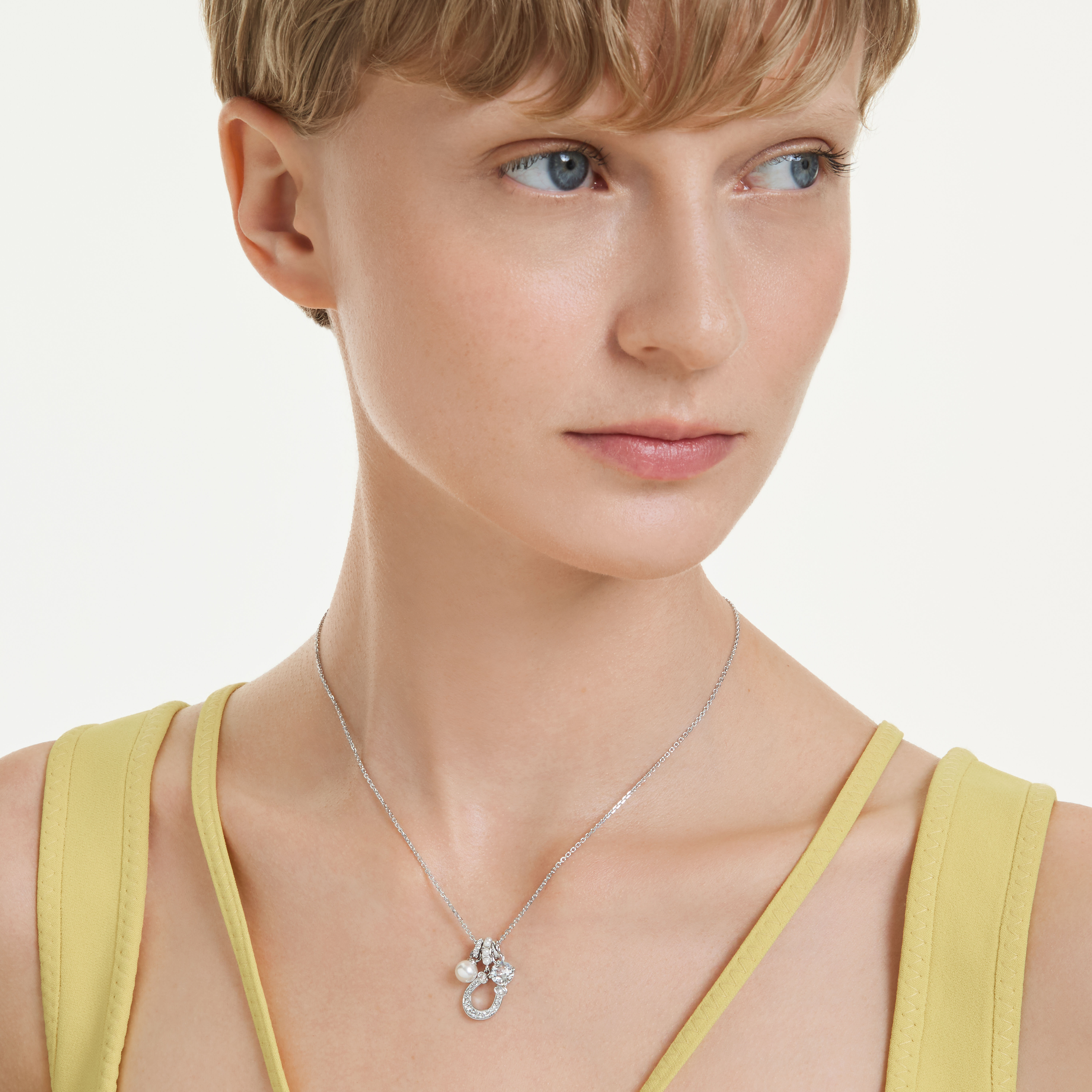 swarovski symbolica pendant  crystal pearl  round cut  pav   horse shoe  white  rhodium plated